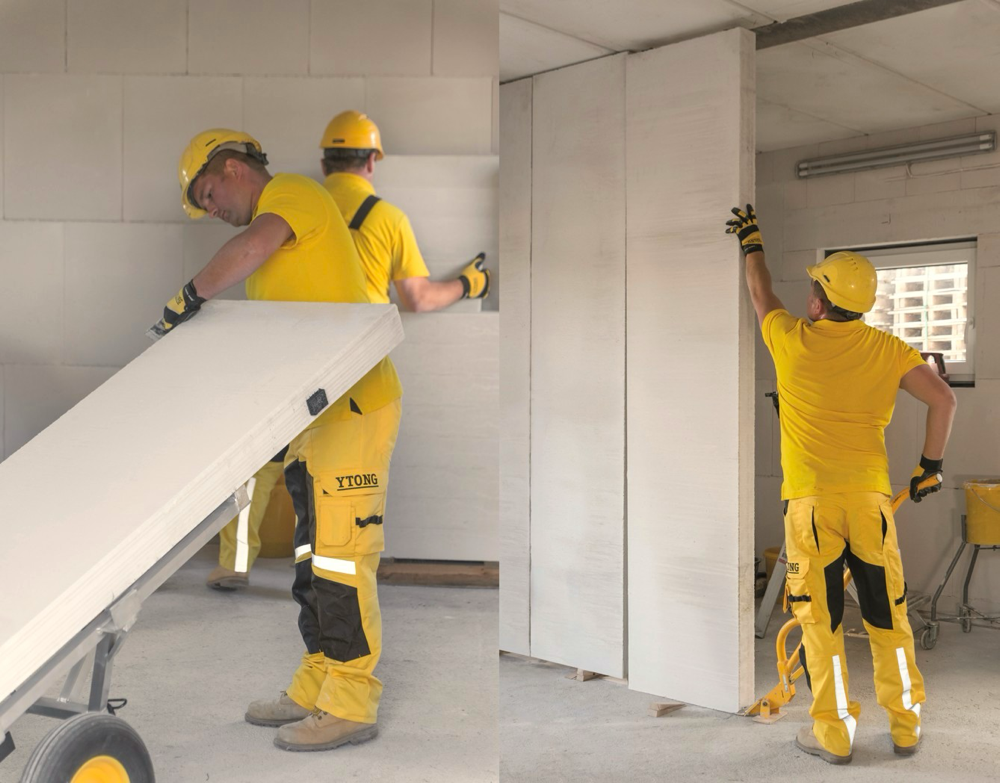 Murarze montują wielkoformatowe panele Ytong do budowy ścian wewnętrznych w budynku